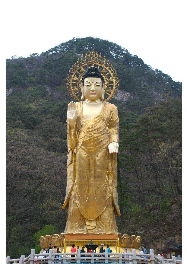 maitreya-staty av guld Foto maitreya-staty av guld