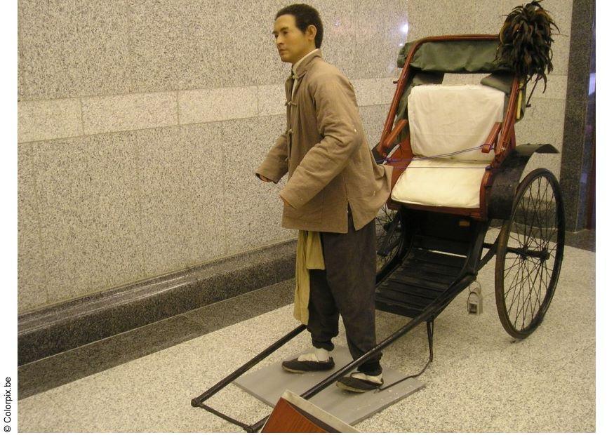 rikshafA¶rare som vaxfigur Foto rikshafA¶rare som vaxfigur